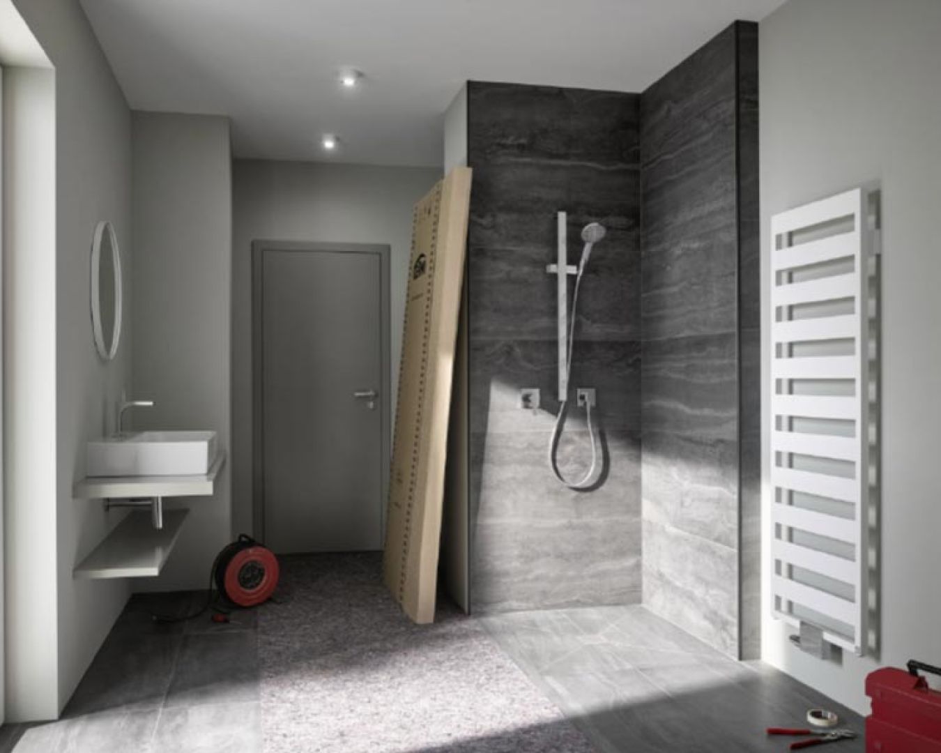 Badezimmer mit Dusche, Handtuchheizkörper und Waschbecken im Rohbauzustand







