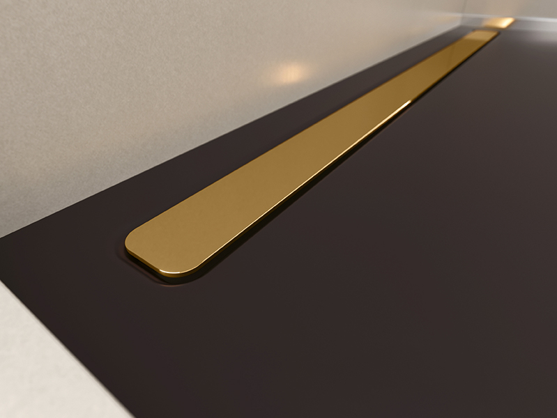 Goldfarbene Ablaufrinne in schwarzer Duschfläche als edles Design-Element